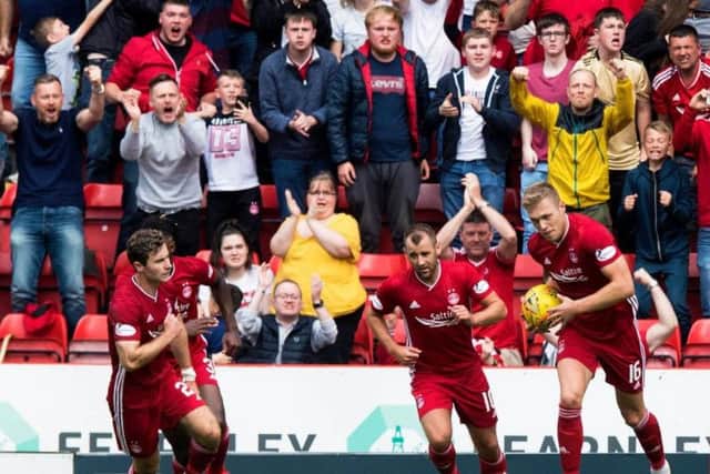 Sam Cosgrove, right, celebrates after scoring against Hearts