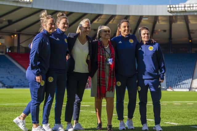 Rose Reilly poses with Scotland head coach Shelley Kerr and players Jo Love, Rachel Corsie, Lee Alexander and Joelle Murray before the Jamaica game. Picture: Ross Parker/SNS