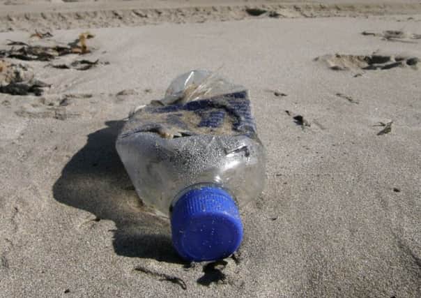 A discarded bottle that could have been floating for years in the sea