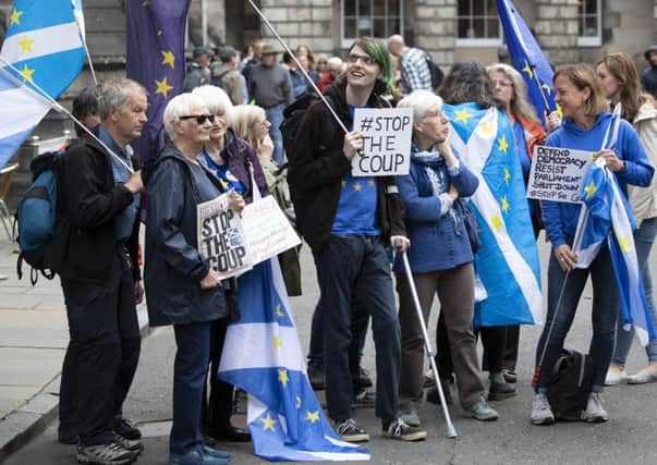 Pro-EU demonstrators outside the Court of Session in Edinburgh. Picture: PA