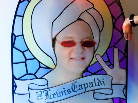 A stained glass image of Lewis Capaldi's face appears at the #ScottishTwitter visitor centre.