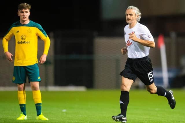 Danny Lennon takes to the pitch after subbing himself on against Celtic Colts