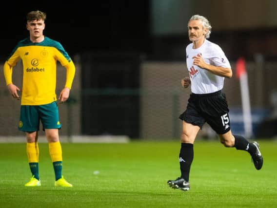 Danny Lennon takes to the pitch after subbing himself on against Celtic Colts