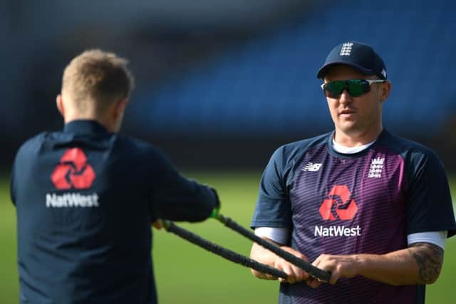 Jason Roy, right, stretching with captain Joe Root, passed a concussion test. Picture: Stu Forster/Getty