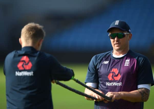 Jason Roy, right, stretching with captain Joe Root, passed a concussion test. Picture: Stu Forster/Getty