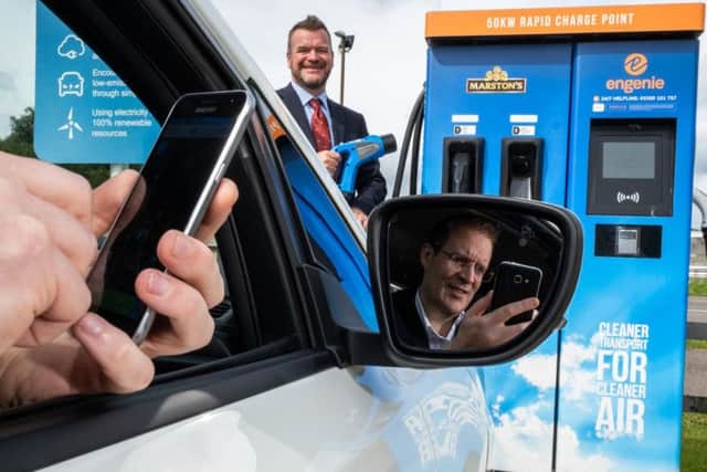 Scott Mathieson (left) and Mike Gill test drive the WattsUp app. Picture: contributed