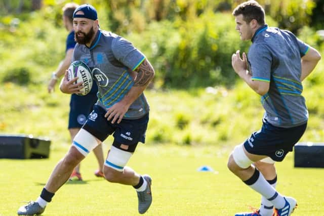 Blade Thomson on the ball as Scott Cummings watches during a training session. Picture: Craig Williamson/SNS