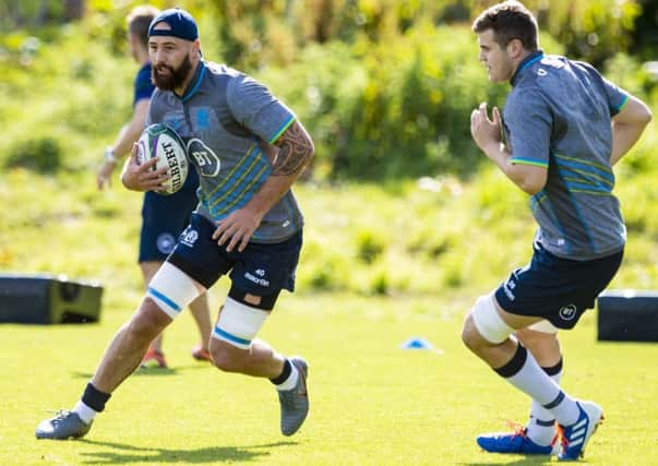 Blade Thomson on the ball as Scott Cummings watches during a training session. Picture: Craig Williamson/SNS
