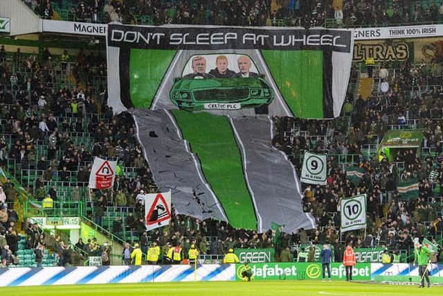 Celtic supporters unfurl a banner. Picture: SNS