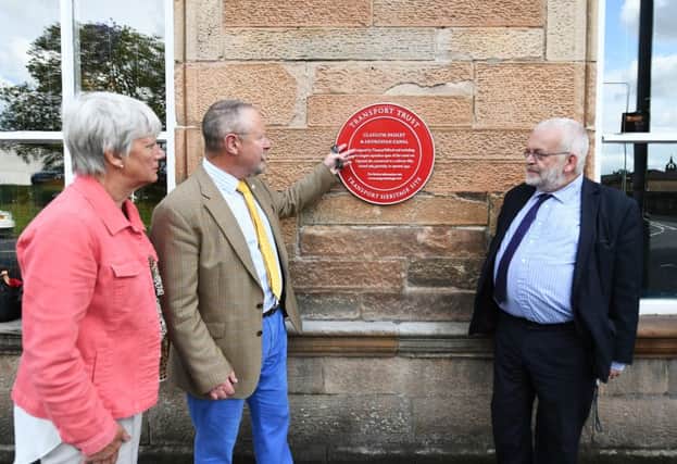 Carolyn Swift, Transport Trust trustee Jerry Swift, and John Yellowlees, as an honorary Rail Ambassador, attend the unveiling of a Red Wheels plaque at historic Canal Station in Paisley, Renfrewshire. Picture: John Devlin