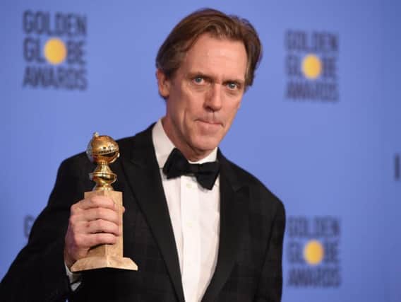 Actor Hugh Laurie with one of his Golden Globe awards (Photo: Getty Images)
