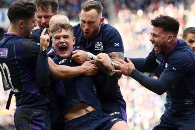 Darcy Graham of Scotland celebrates scoring his sides first try with his team mates during the Guinness Six Nations match between Scotland and Wales in March 2019 (Photo: Getty)