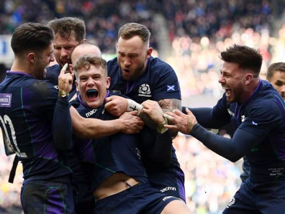 Darcy Graham of Scotland celebrates scoring his sides first try with his team mates during the Guinness Six Nations match between Scotland and Wales in March 2019 (Photo: Getty)