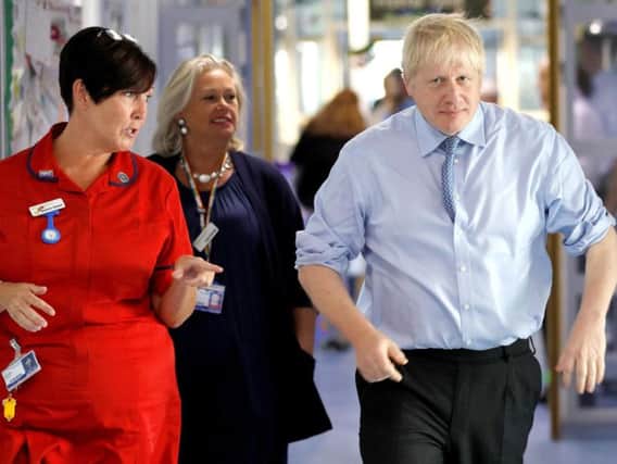Prime Minister Boris Johnson visited an NHS hospital today. (Photo: Peter Nicholls - WPA Pool/Getty Images)