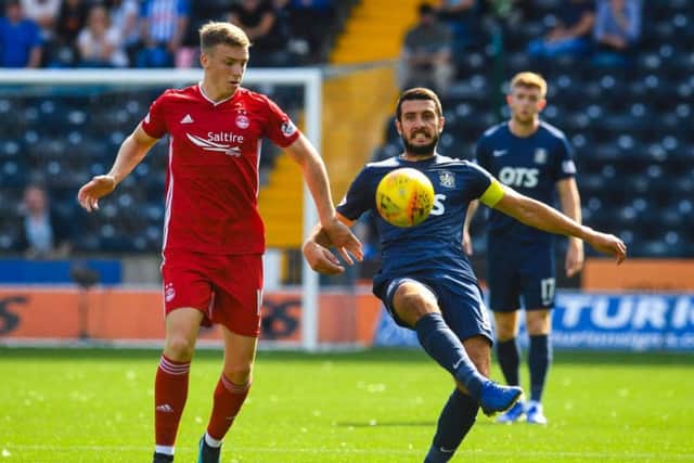 Kilmarnock's Gary Dicker and Lewis Ferguson in action