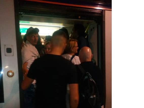 Passengers boarding a crowded train at Waverley station tonight. Picture: Dani Garavelli