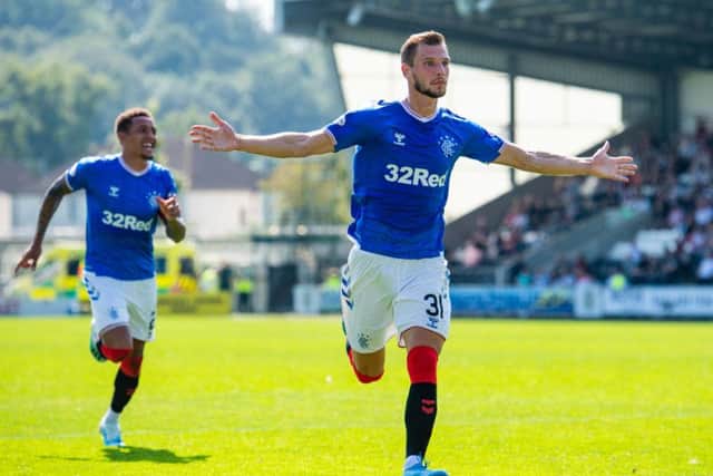 Borna Barisic celebrates after giving Rangers the lead.
