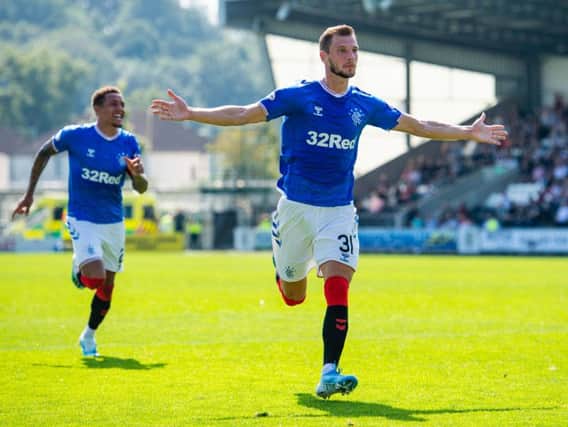Borna Barisic celebrates after giving Rangers the lead.