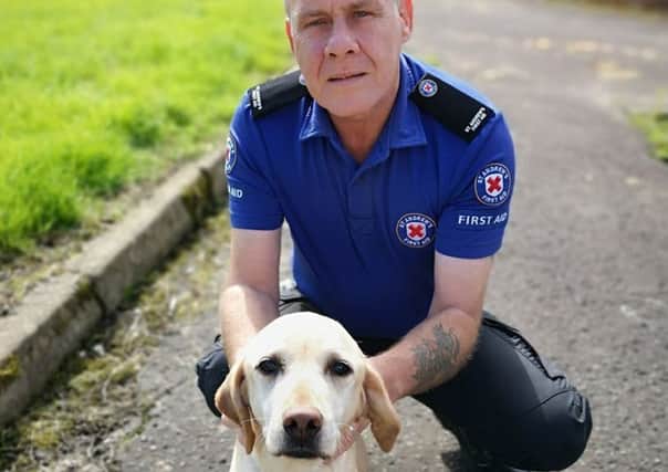 Norman Milne, a St Andrews First Aid volunteer, with his dog Goldie