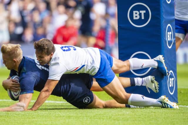 Scotland centre Chris Harris dives over the tryline to score against France. Picture: Gary Hutchison/SNS/SRU