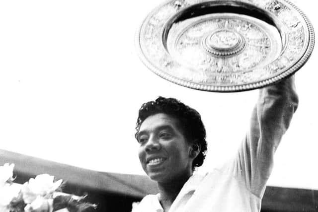 July 1958, Althea Gibson celebrates victory at Wimbledon after beating Britain's Angela Mortimer in the final. Picture: AP