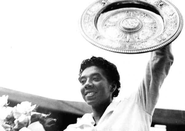 July 1958, Althea Gibson celebrates victory at Wimbledon after beating Britain's Angela Mortimer in the final. Picture: AP