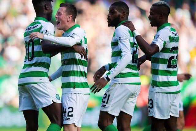 Celtic teammates celebrate as Callum McGregor, left centre, makes it 2-0.
