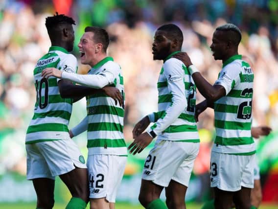 Celtic teammates celebrate as Callum McGregor, left centre, makes it 2-0.
