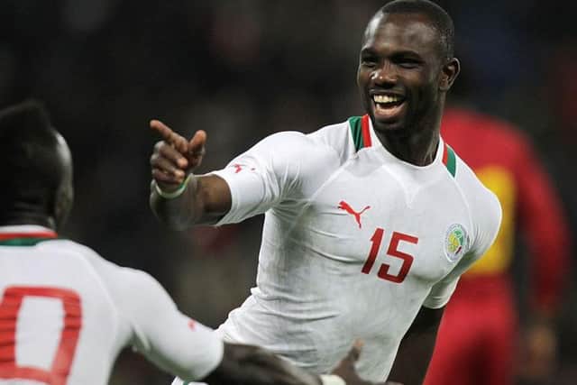 Moussa Konate celebrating after scoring for Senegal.