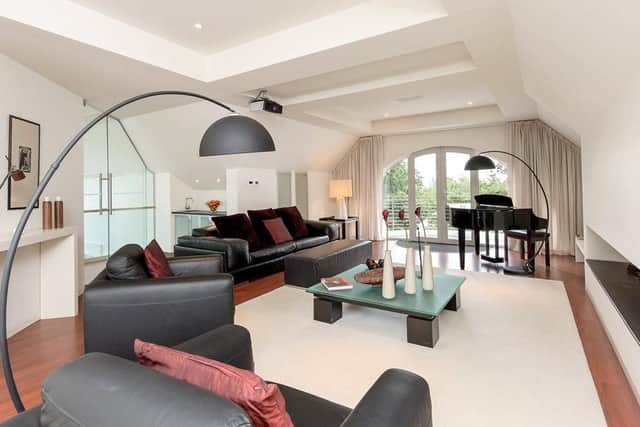 This room has a modern, statement fireplace.