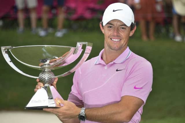 Rory McIlroy holds the FedEx Cup, after winning the Tour Championship at East Lake on Sunday. Picture: AP.