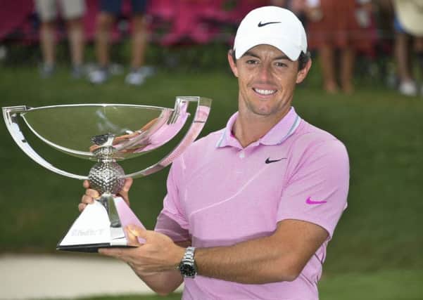Rory McIlroy holds the FedEx Cup, after winning the Tour Championship at East Lake on Sunday. Picture: AP.