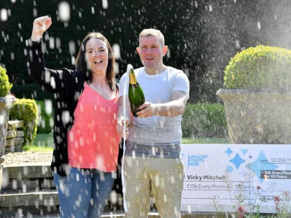 Vicky Mitchell and partner Adam Fry celebrating their National Lottery Set For Life victory. Photo: Anthony Devlin/PA Wire.