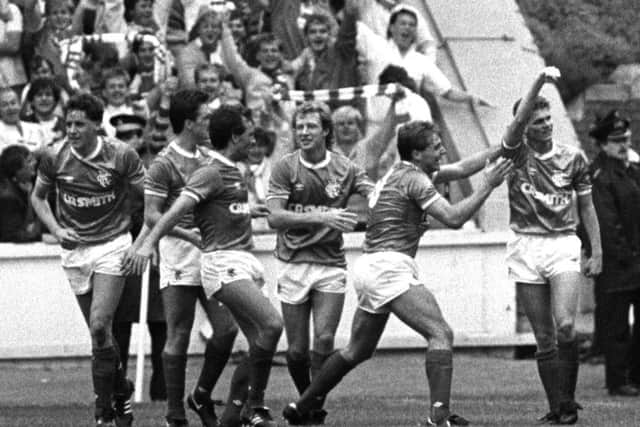 Ian Durrant, far right, salutes the Rangers fans after scoring the only goal of the game against Celtic at Ibrox on 31 August 1986. Picture: Gareth R Reid