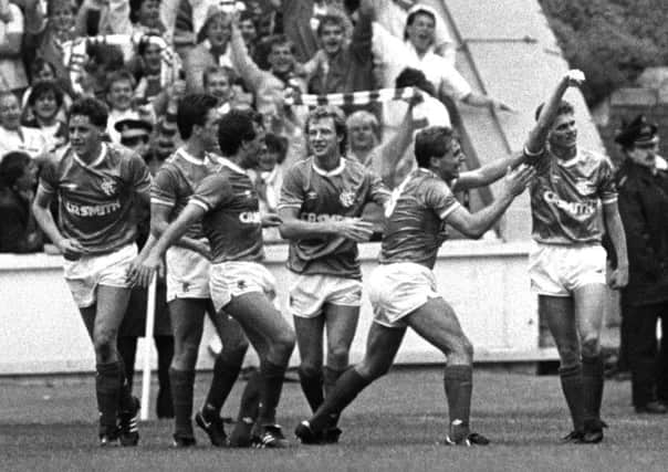 Ian Durrant, far right, salutes the Rangers fans after scoring the only goal of the game against Celtic at Ibrox on 31 August 1986. Picture: Gareth R Reid