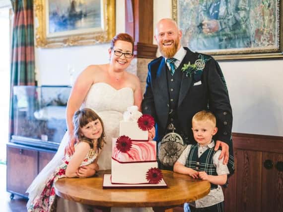 Caroline and Phil Learmonth gave the top tier of their wedding cake to the ambulance crew behind Carolines life-saving intervention. Picture: Contributed