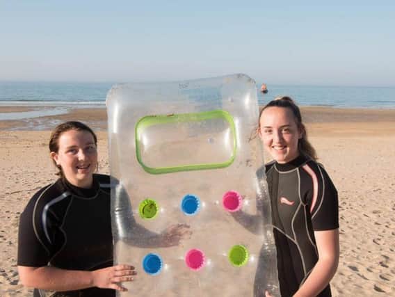 Two teenage girls have been praised by emergency services after using a lilo to rescue a man and child in water off the north east coast of Scotland. Picture: PA