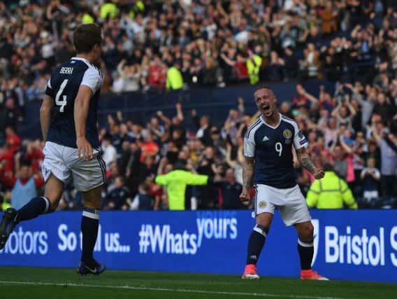 Leigh Griffiths celebrates after scoring against England.