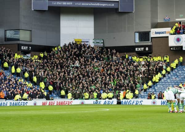 Celtic fans were shoehorned into a corner of Ibrox last season when Rangers cut the clubs ticket allocation. Picture: SNS