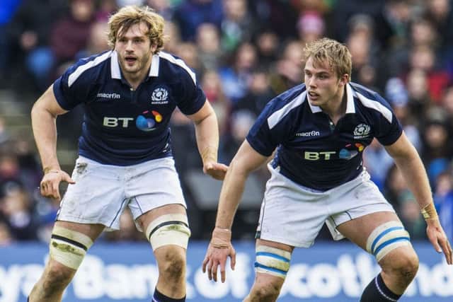 Jonny Gray, right, in action for Scotland during the 2017 Six Nations with his brother Richie, who has made himself unavailable for next month's World Cup. Picture: SNS/SRU