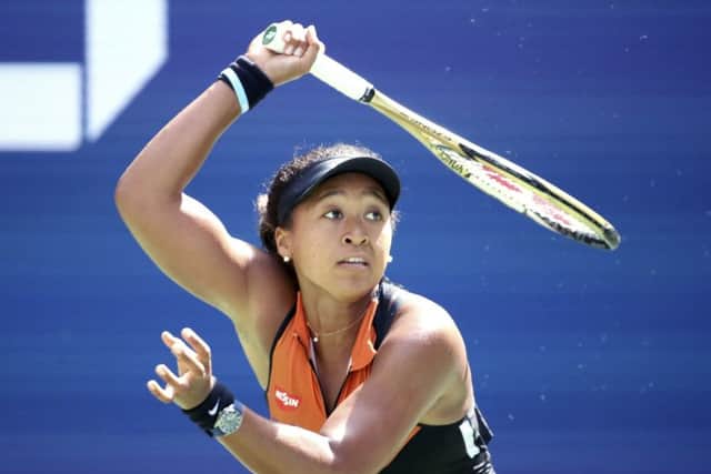 Naomi Osaka plays a return to Anna Blinkova who forced the defending champion into a deciding final set in their first-round match at Flushing Meadows. Picture: AP.