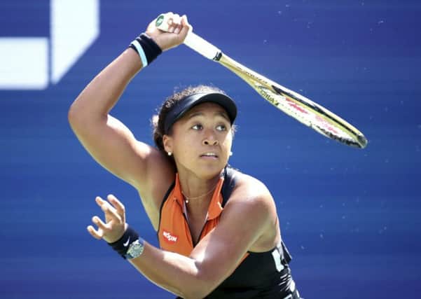 Naomi Osaka plays a return to Anna Blinkova who forced the defending champion into a deciding final set in their first-round match at Flushing Meadows. Picture: AP.