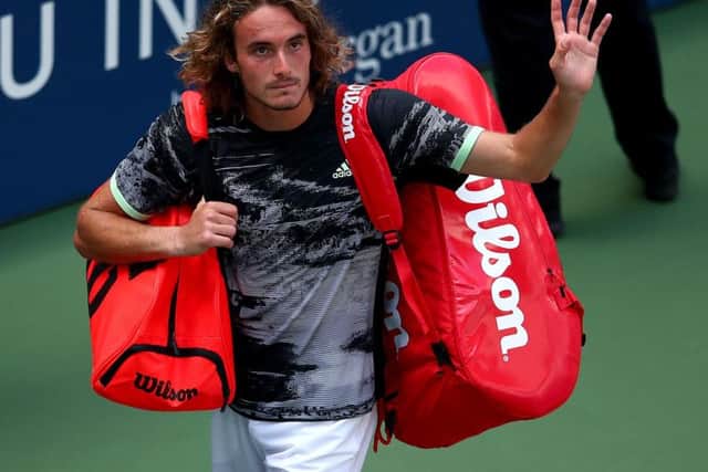 Stefanos Tsitsipas was penalised for a coaching violation and a time violation, and was overheard saying to umpire Damien Dumusois "you're all weirdos"