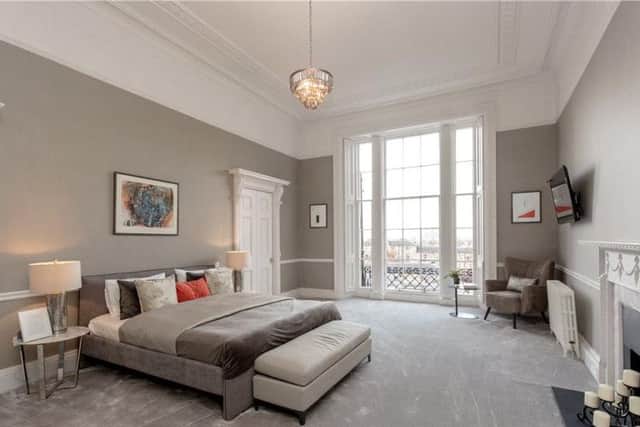 One of the five bedrooms, the huge master room has an en suite and full height window.