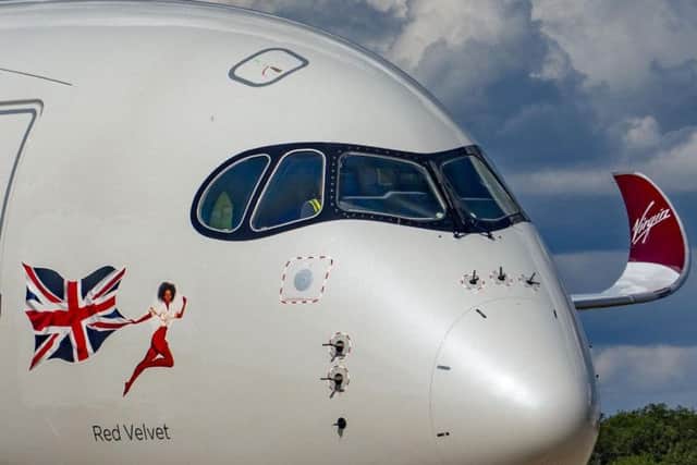 Virgin Atlantic has unveiled its first aircraft featuring a revamped "flying icon" after it stopped using pin-up girls. Picture: PA