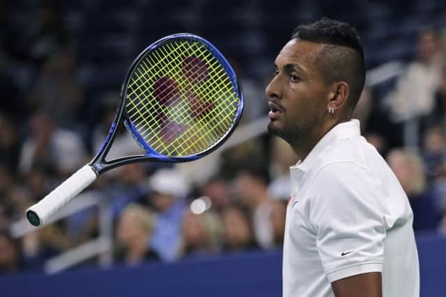 Nick Kyrgios flips his racket as he waits for Steve Johnson to serve during their. Picture: Charles Krupa/AP