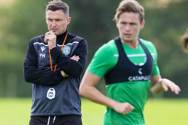 Hibs manager Paul Heckingbottom observes Scott Allan during training. Picture: Ross MacDonald /SNS