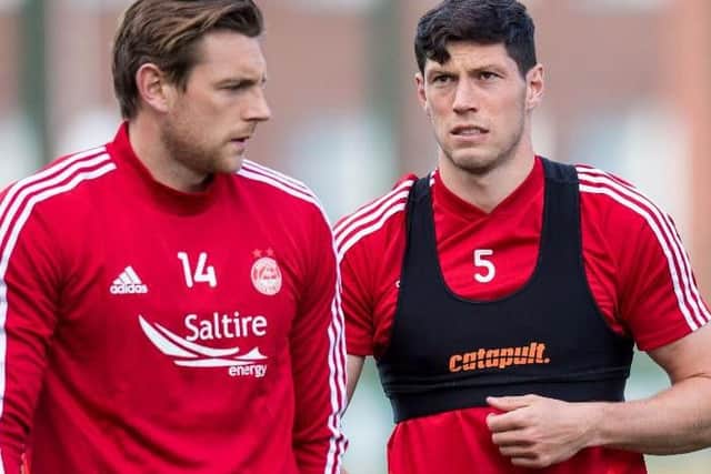 Ash Taylor, left, and Scott McKenna are both facing spells on the sidelines