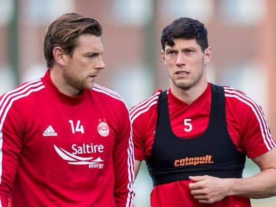 Ash Taylor, left, and Scott McKenna are both facing spells on the sidelines