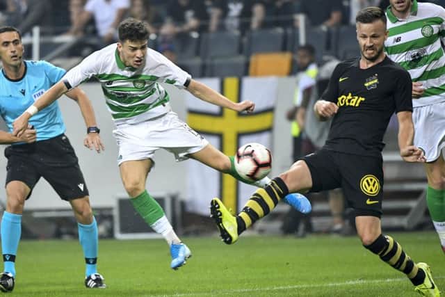 Celtic's Mikey Johnston, left, and AIKs Robert Lundstrom battle for the ball. Picture: Jonas Ekstromer/TT News Agency via AP